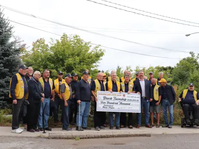 Sunderland Lions members with ceremonial cheque for project
