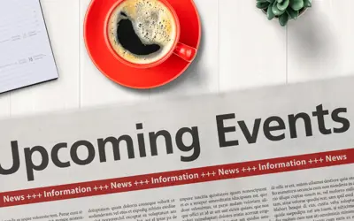 newspaper on desk that reads upcoming events 