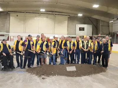 Members of the Sunderland Lions Club with shovels in the dirt